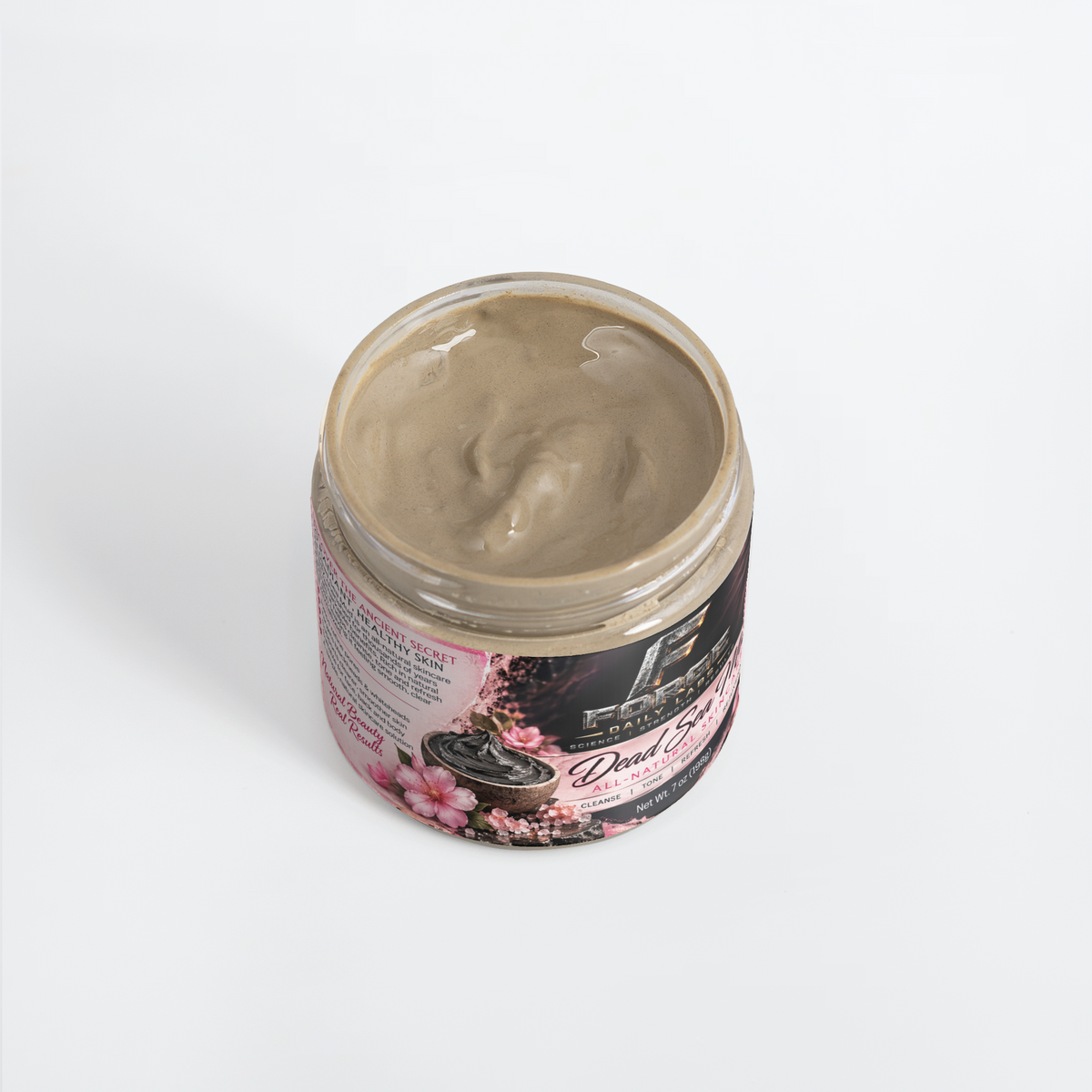 An open jar of Dead Skin Cell mask cream showing the beige-colored product inside, set against a plain white background.