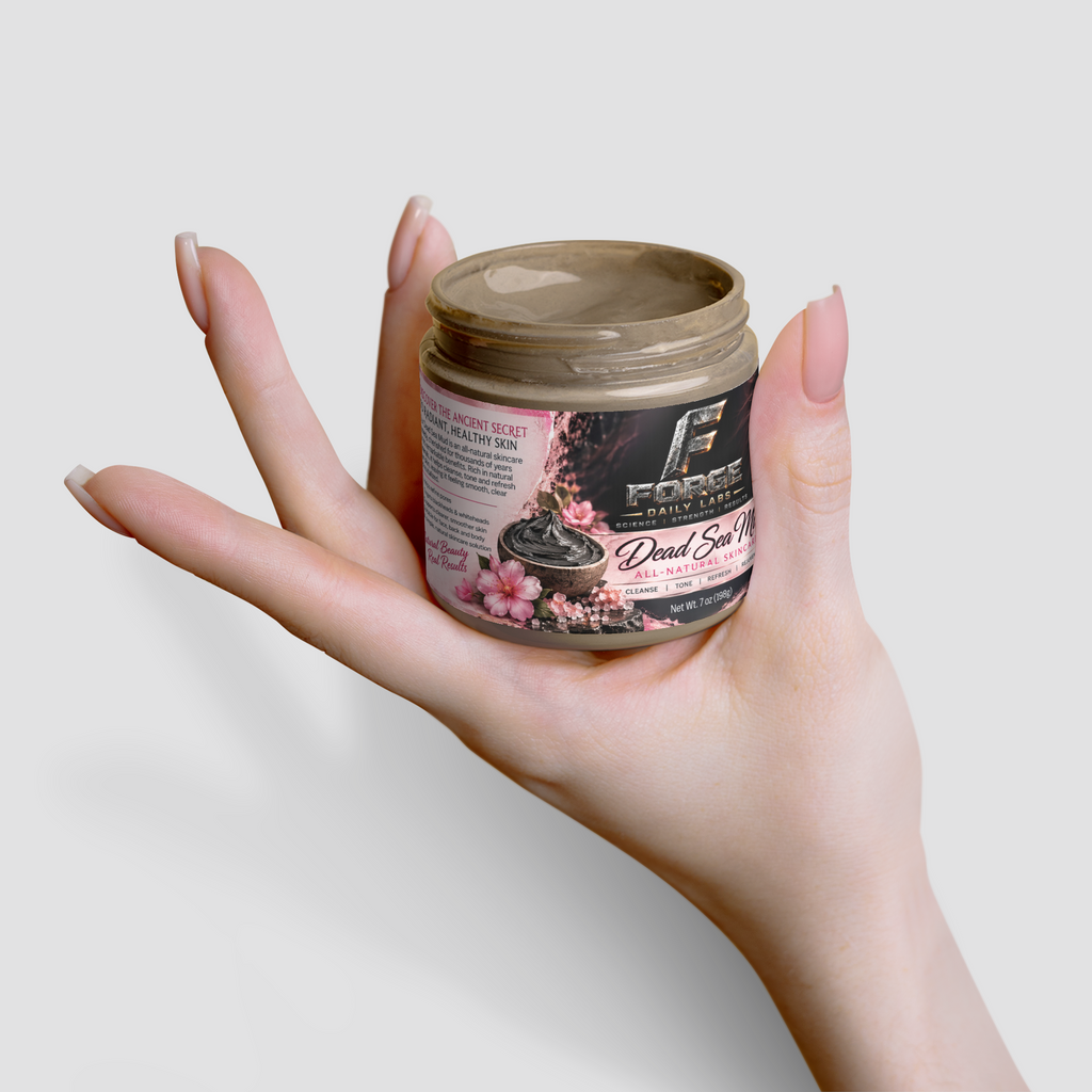 A hand with manicured nails holds a jar of Forge Skin Care Dead Skin Remover against a clean, light gray background.