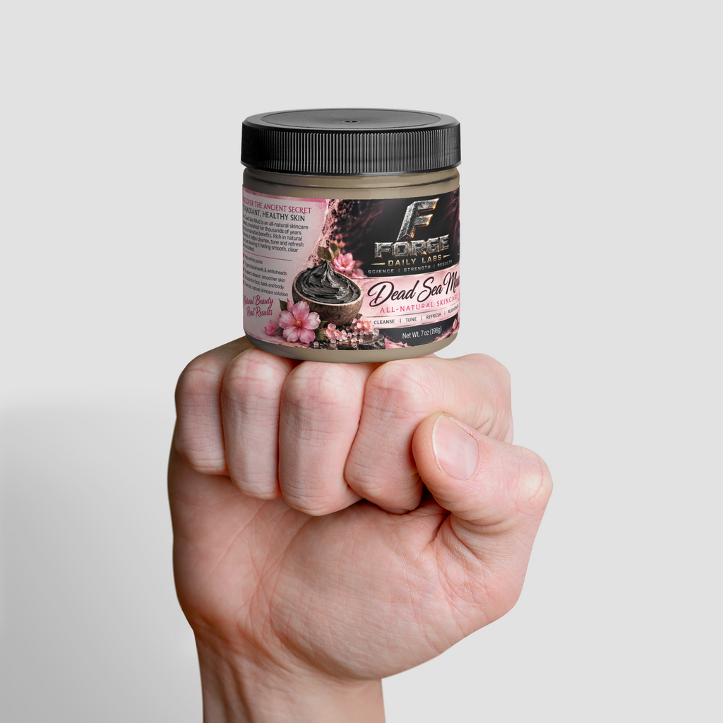 A hand holding a jar of Force Daily Care Dead Skin Hair Remover against a light gray background.